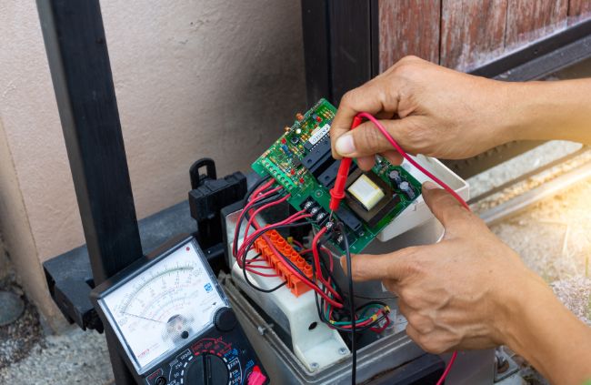 Automatic gate repairs using a multimeter on a gate control board – expert automatic gate servicing by Auto Gate Guys