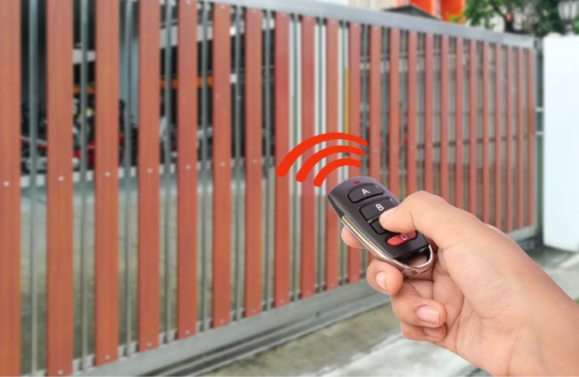 Wireless gate opener controlling a modern sliding gate installed by Auto Gate Guys, offering convenience and security for Central Coast homes